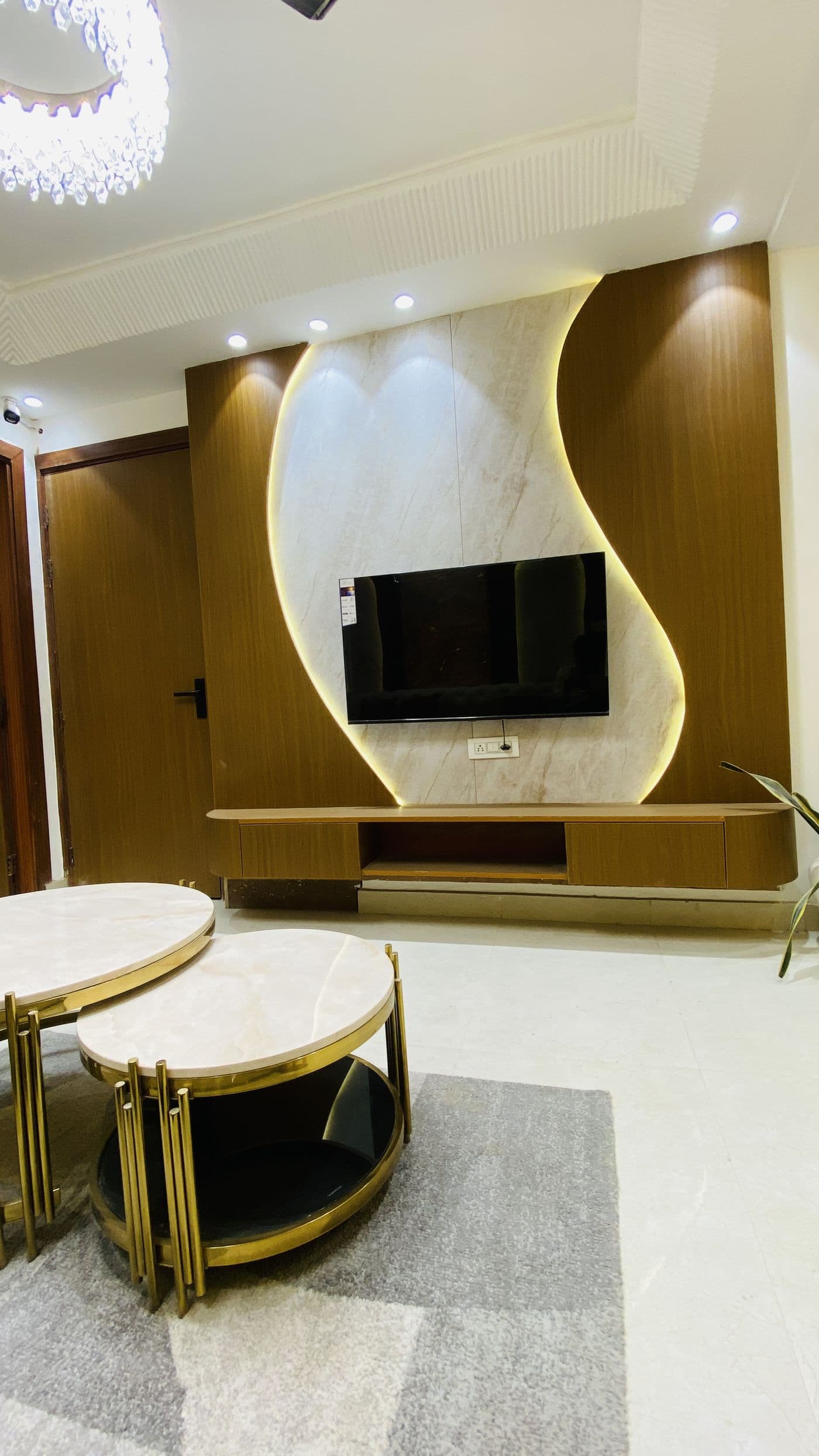 Backlit marble-finish TV wall